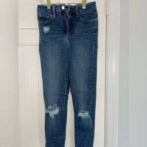 gap skinny jeans with rips.. perfect for a flowy shirt! size 24